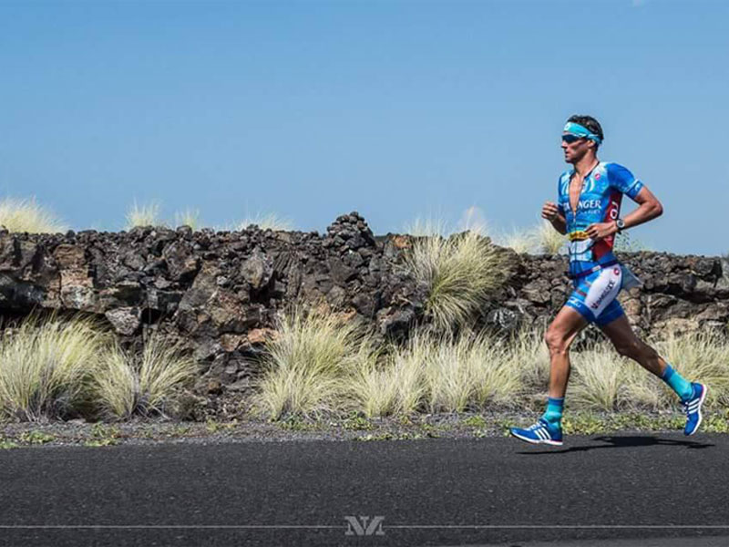 Running Running. An athlete run a road race.